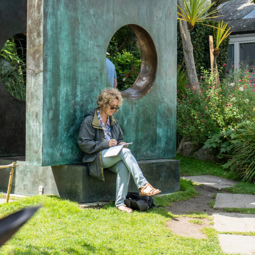 St Ives School of Painting student sketching in a sculpture garden 