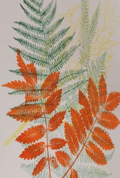 Autumnal print by Annabel Wilkes in orange and green, leaf monoprint