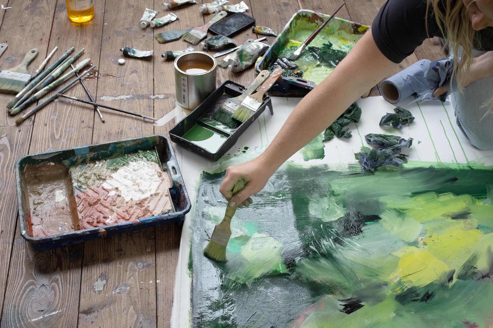 Artist Caroline Robinson working on a large scale painting in the Roy Ray Studio at The St Ives School of Painting