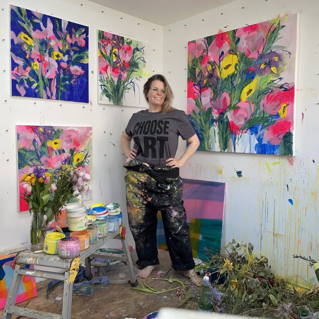 Faye Bridgwater in her studio painting flowers