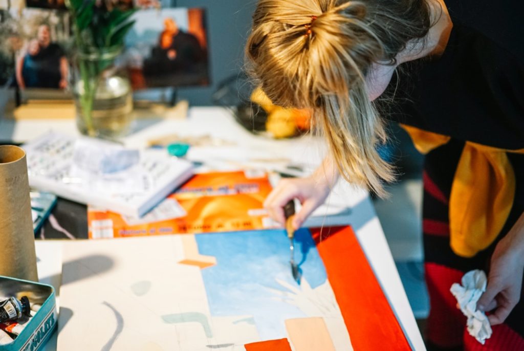 Girl working on her painting.